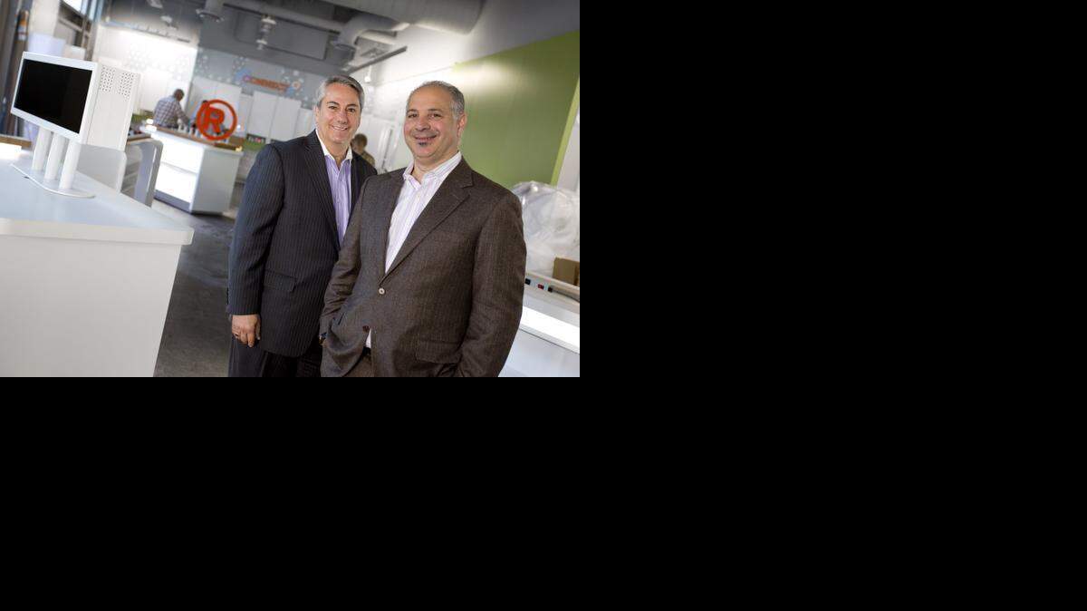 
RadioShack CEO Joseph Magnacca, right, with Michael DeFazio, senior vice president for store concepts, shown in Fort Worth in 2013. 

