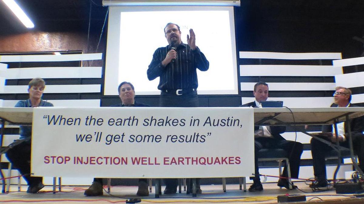 A speaker at a public meeting in Azle, in January 2014, discussing area earthquakes.