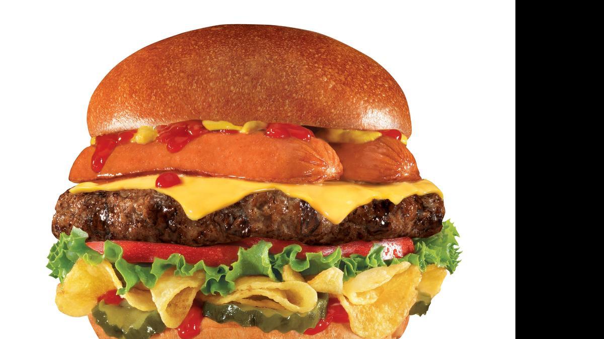 
This undated product image provided by CKE Restaurants shows Carl's Jr. and Hardee's new “Most American Thickburger.” A beef patty topped with a split hot dog sits atop a layer of Lay's potato chips between hamburger buns, with ketchup, mustard, tomato, red onion, pickles and American cheese. The burger will have 1,030 calories and 64 grams of fat. 
