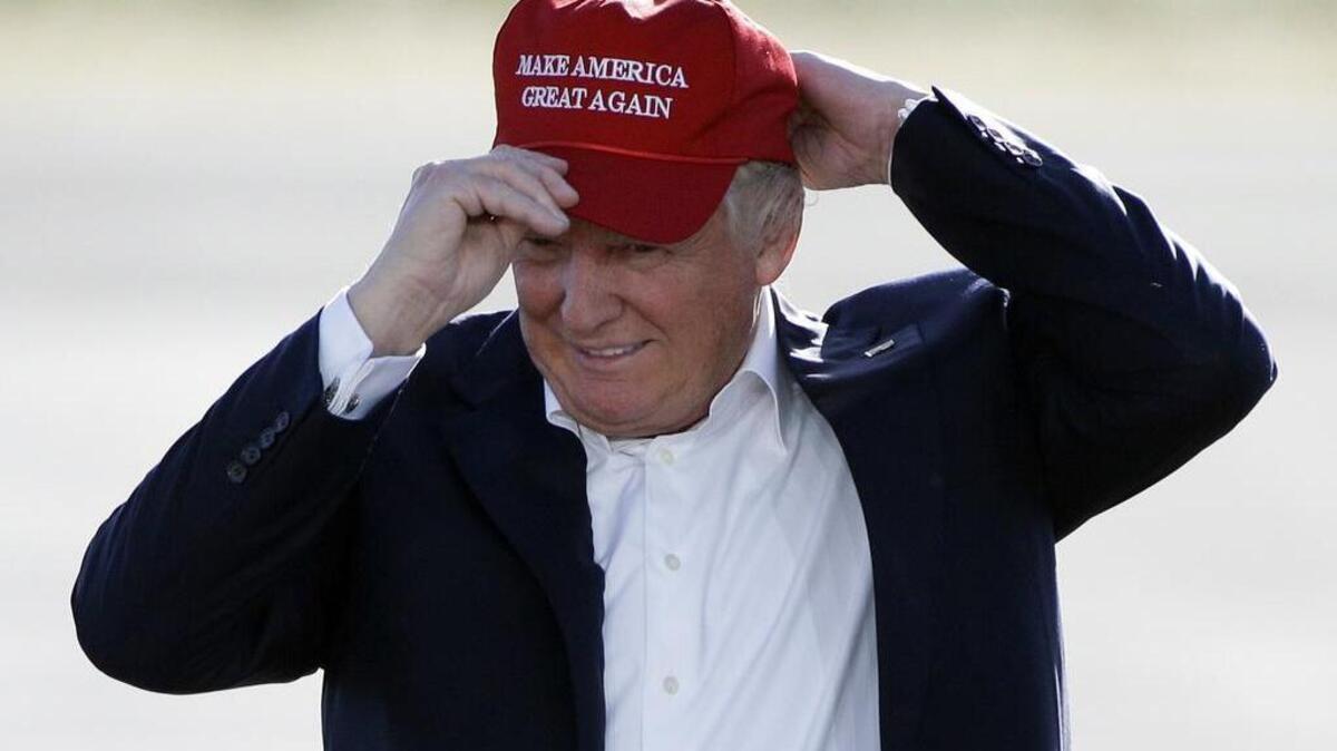 In June 2016 then presidential candidate Donald Trump dons one of his “Make America Great Again” gimme caps. His slogan was an inspiration for a new investment fund created by a Fort Worth-based money manager.