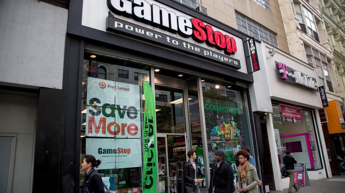 Pedestrians walking past a GameStop store in New York in November.