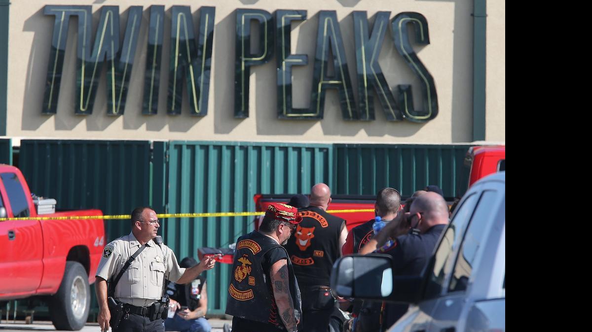 
Authorities investigate a shooting in the parking lot of the Twin Peaks restaurant Sunday in Waco, Texas.
