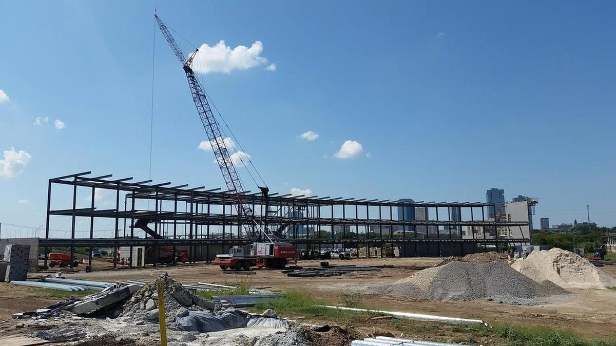 Topgolf, with its curved shape for hitting bays, is beginning to rise on Fourth Street northeast of downtwown Fort Worth.