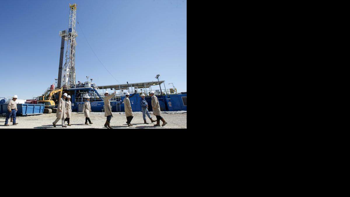 
Quicksilver Resources gives a tour to Japanese elected officials and local representatives at their drill site near the Texas Motor Speedway in 2013. 
