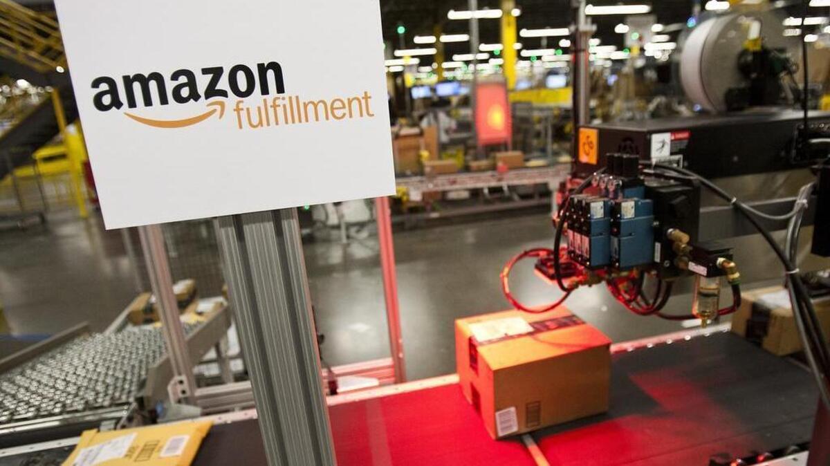 A view of the “SLAM” line (short for scan, label, apply and manifest) at Amazon’s Fulfillment Center in Haslet. The center houses millions of products that are sorted, packaged and sent out to clients in the region.