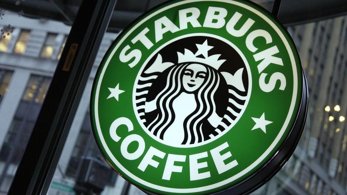 Starbucks says it will start the process of trying to filter out porn on its stores’ Wi-Fi.