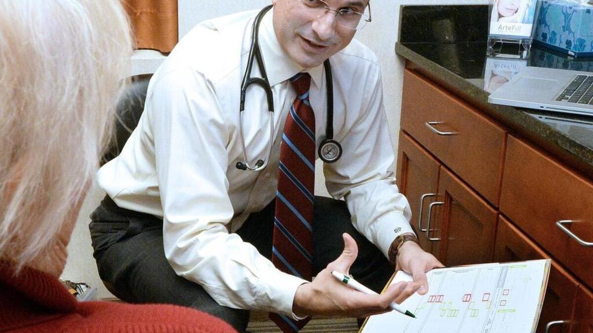The Centers for Medicare and Medicaid Services laid out a payment and policy update for 2017 that boils down to a rate increase of around 3.5 percent when including adjustments. In this 2014 photo, Dr. Dino Kanelos of Carolina Family Heathcare talks with a 75-year-old Medicare patient.