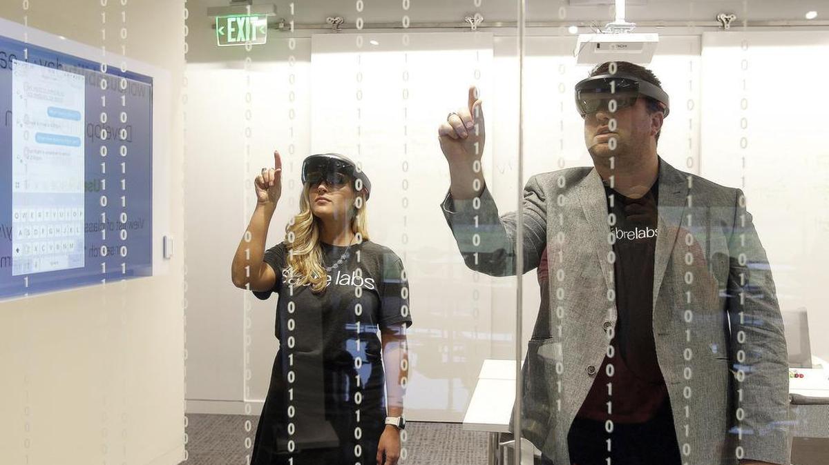 Sabre Labs’ Mark McSpadden and Hannah Howell demonstrate software on virtual reality glasses at Sabre in Southlake on Wednesday, November 9, 2016.