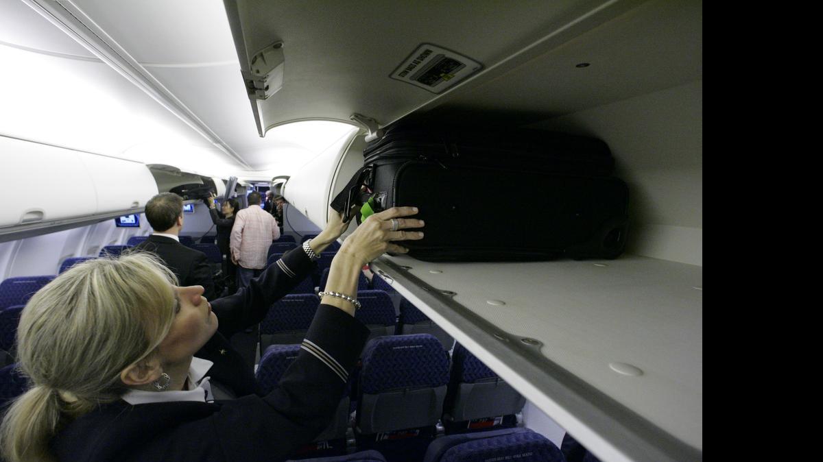 
Global airlines announced new guidelines that would shrink the size of carry-on bags allowed on planes, part of an effort to free up space in overhead bins. 
