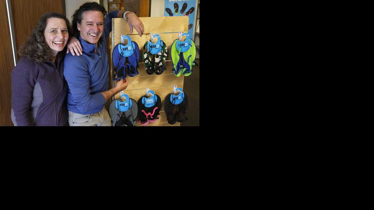 
Lena Phoenix and Steven Sashen, stand with a display of a few examples of their company's sandals, as they move into their newer, larger headquarters, in Broomfield, Colo. The husband and wife team hope for an easier time getting a Small Business Administration loan in the new year. The application and approval process they went through for a $500,000 loan in 2014 took eight months, longer than the two months their lender initially forecast.


