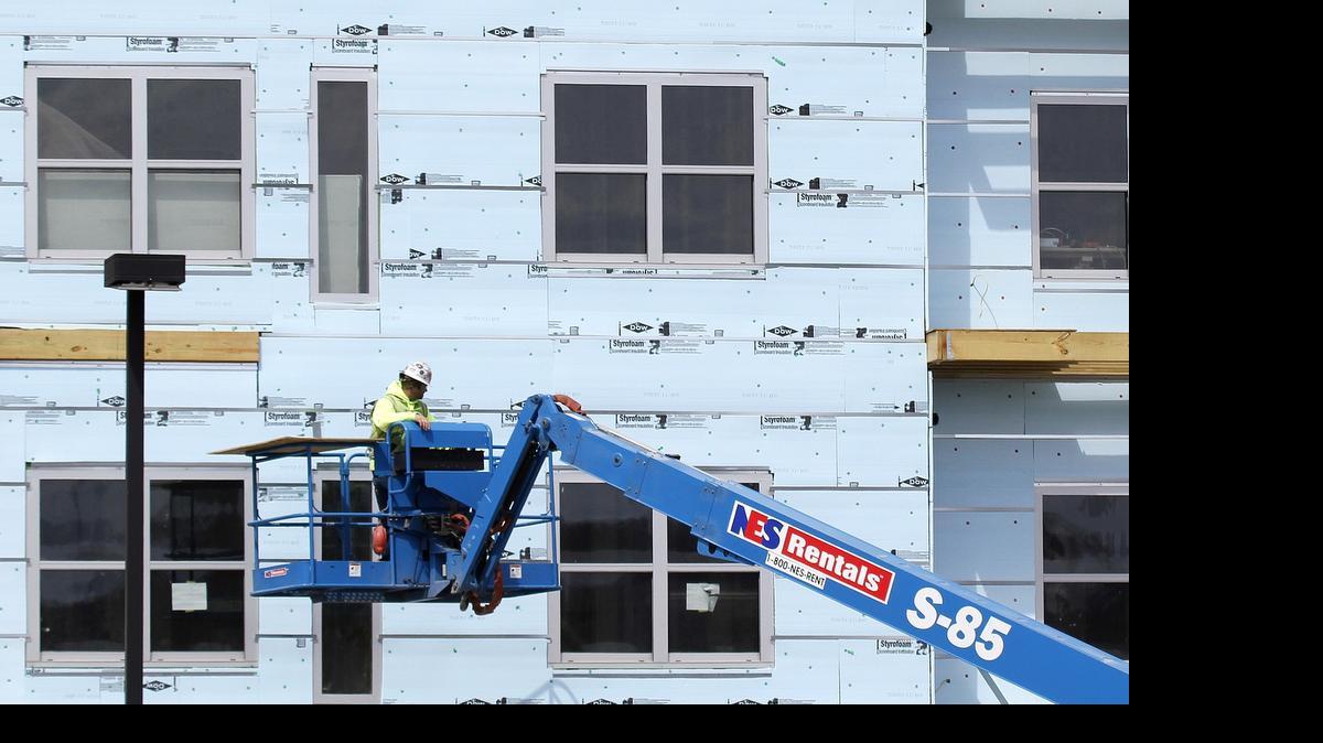 
Builders broke ground on homes last month at the fastest pace in more than seven years. In part, the surge in housing starts in April reflected a rebound from a dismal winter that shut down construction sites and hampered growth across the economy. In this March 31, construction on a new apartment complex continues on Pittsburgh's Southside.


