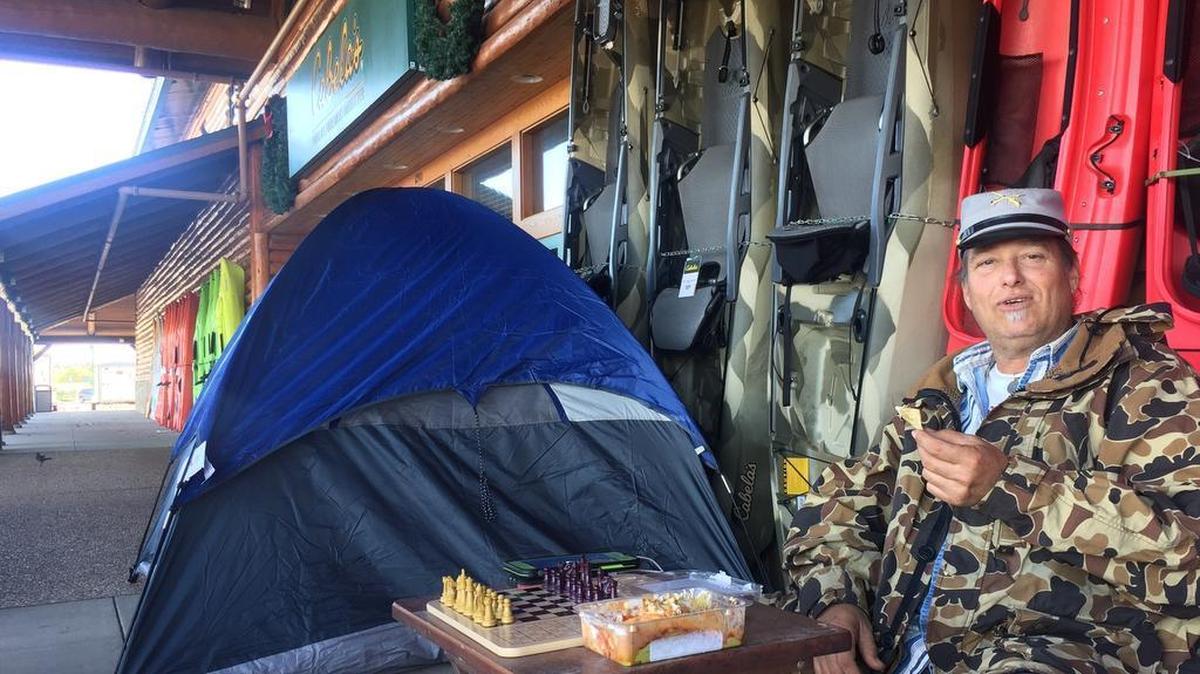 A customer camps out in front of a Cabela’s outdoor store on Thanksgiving Day 2016 in far north Fort Worth. Hundreds of campers are expected again this year, including a small number that could win a free gun.