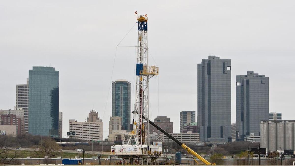A gas drilling rig operates on the banks of the Trinity River just east of downtown Fort Worth, Texas, Friday, December 23, 2011.