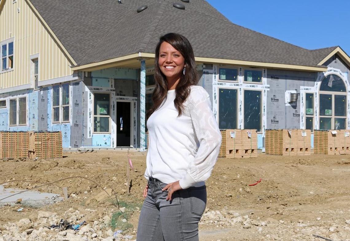 Caroline Revard stands in front of her home under development at the Walsh Ranch in Fort Worth, TX.