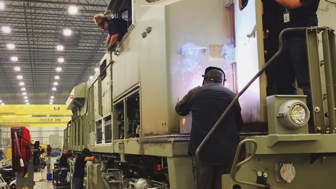 Workers put together a locomotive at General Electric’s Fort Worth plant.
