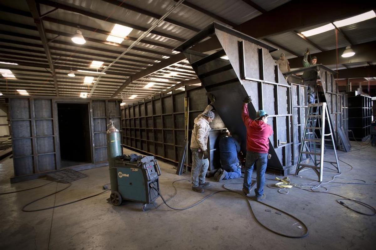 A bomb shelter under construction at Rising S Company south of Dallas in 2017. A survey released last week shows that two-thirds of Americans are buying supplies to survive a natural or political disaster.