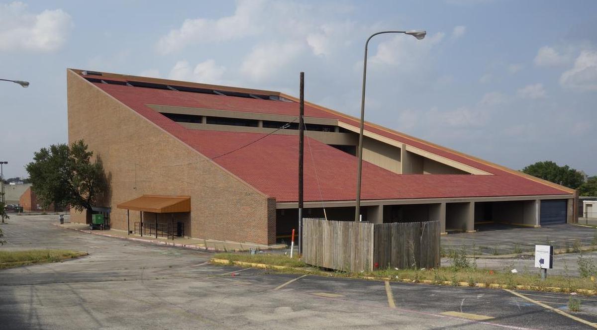 This angular red brick building on the corner of NW 23rd and Main Street on the south edge of the Stockyards area (shown in early 2017) was demolished to make way for a Springhill Suites hotel.