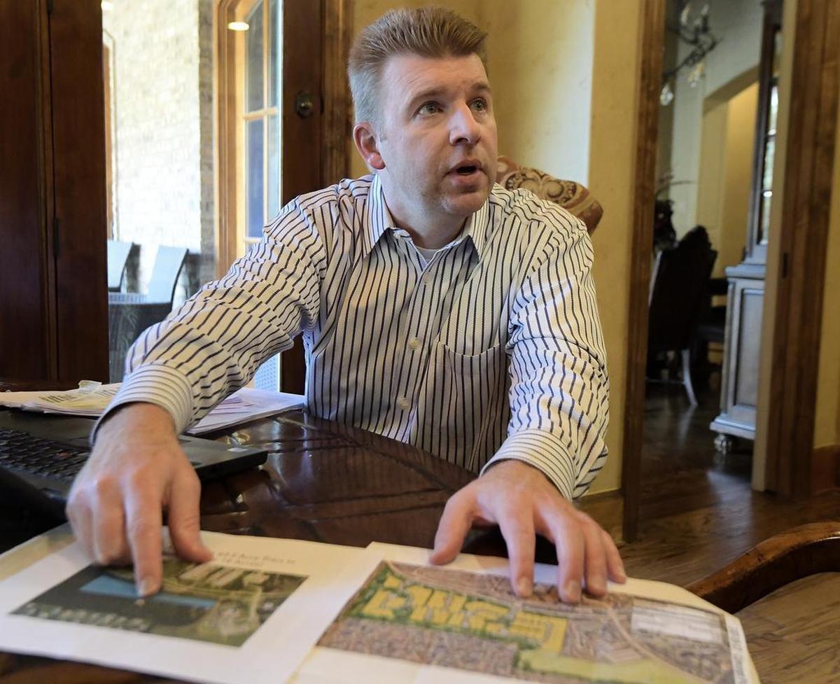 Neil McNabnay talks about his opposition to a proposed zoning change in his neighborhood in Westlake. The Westlake town council last week rejected the plan, which was opposed by more than 100 neighbors.