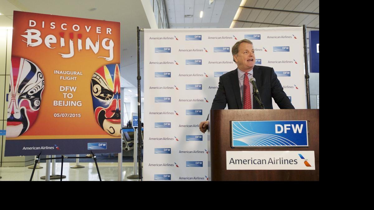 
American Airlines CEO Doug Parker speaking during a ribbon-cutting ceremony to mark the airline’s inaugural flight to Beijing from DFW Airport in May. 

