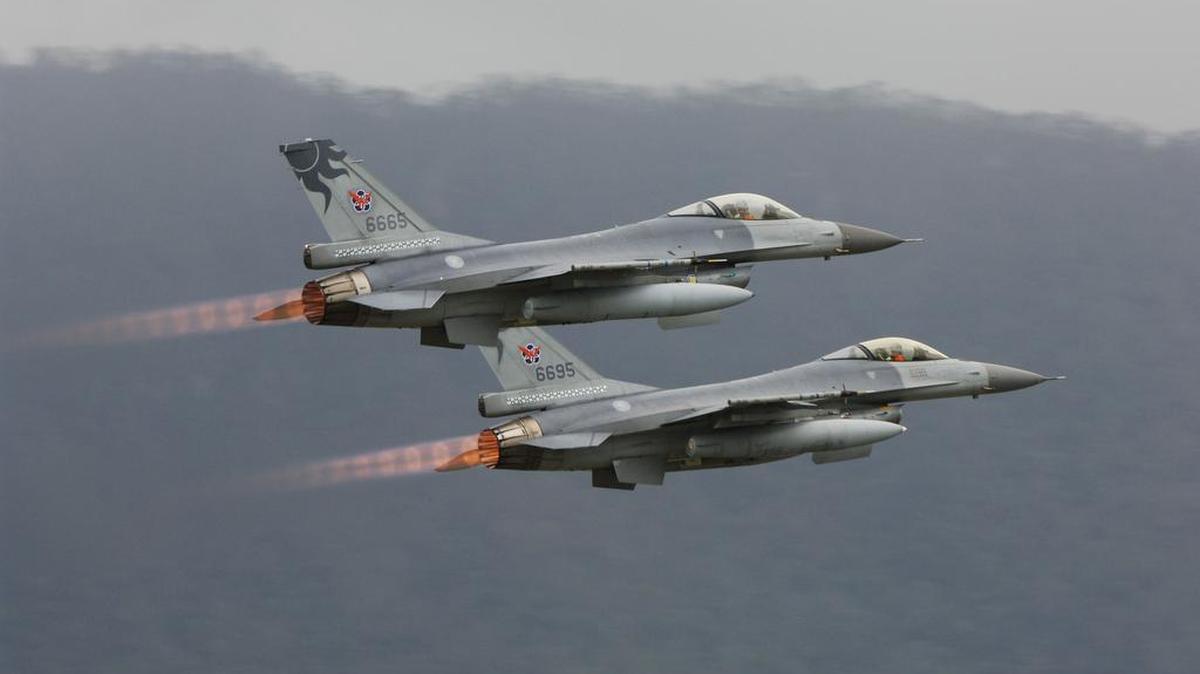 Two Taiwanese F-16 fighter jets, built in Fort Worth, flying over the island nation.