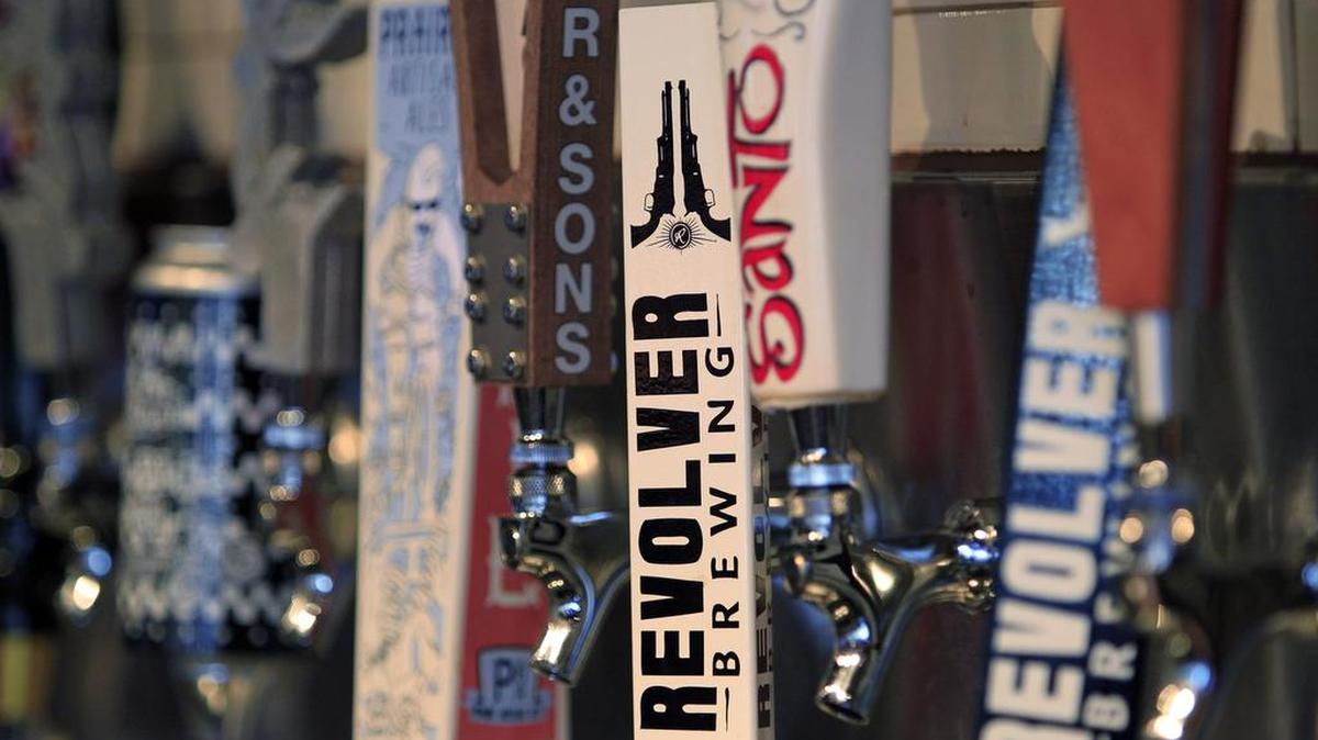 Craft brewers say that a 2013 state law unfairly hinders their ability to grow.