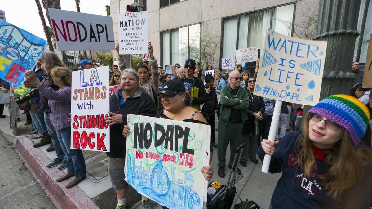 Opponents of the Dakota Access pipeline protesting outside the Army Corps of Engineers office in Los Angeles last week. An executive with Energy Transfer Partners told Congress on Wednesday that protesters in North Dakota have assaulted pipeline workers and destroyed millions of dollars worth of equipment.