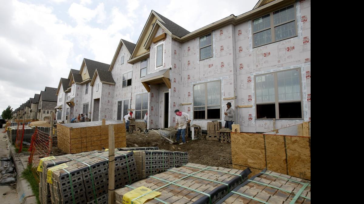 
New homes are built at Viridian development in Arlington on Wednesday. . Housing prices rise with fewer houses on the market. 
