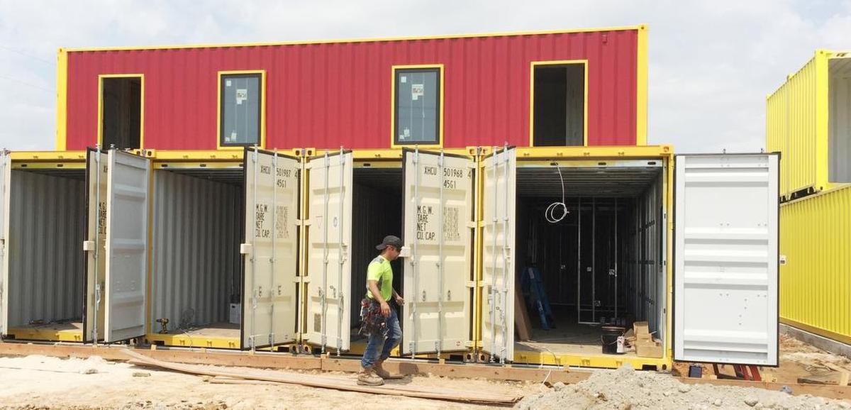 Shipping containers are being used in the construction of a Box Office Warehouse Suites business park in the Haslet area.
