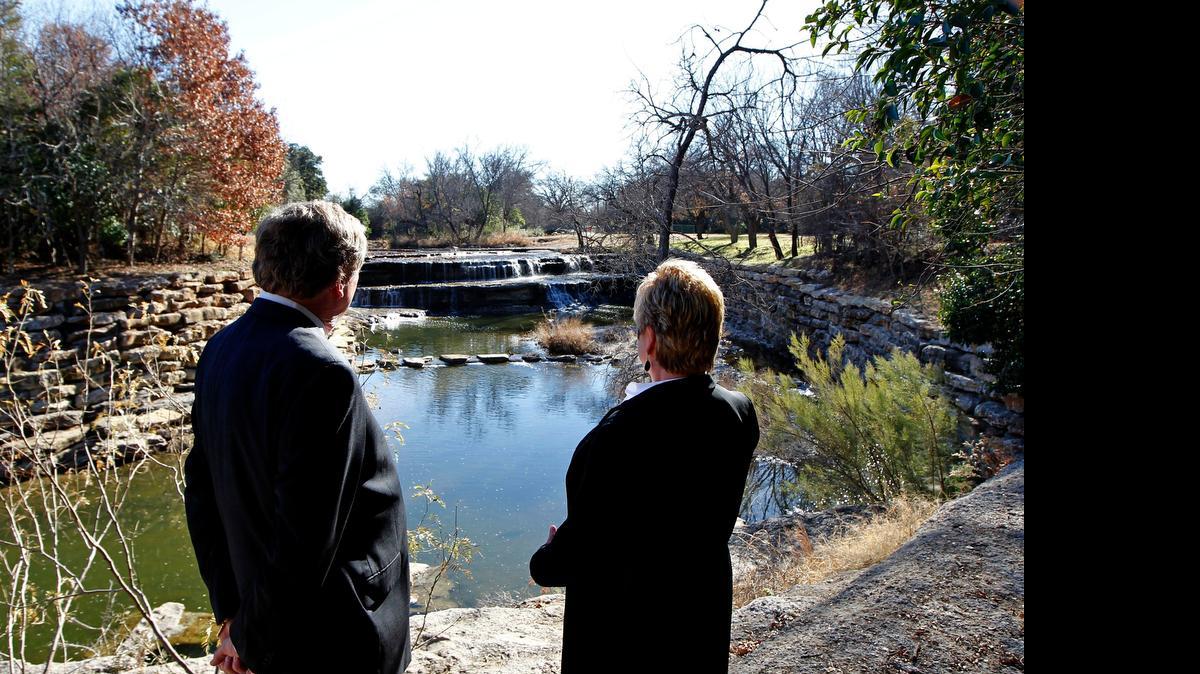 
Jack Stevens (left) with the Tarrant Regional Water District, and Linda Christie (right), community and government affairs director with the district near the falls at the Airfield Falls Trailhead in 2013. The trailhead is still under construction.
