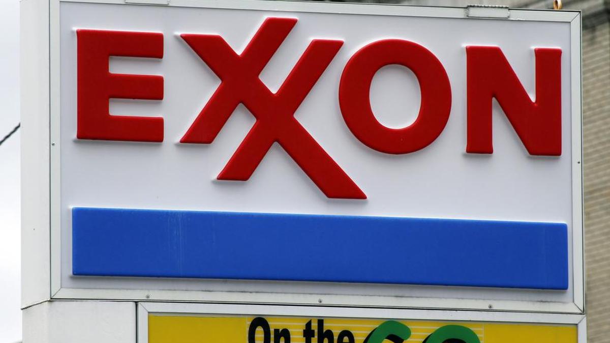 Exxon Mobil earned $1.7 billion in the second quarter, down 59 percent from a year ago.