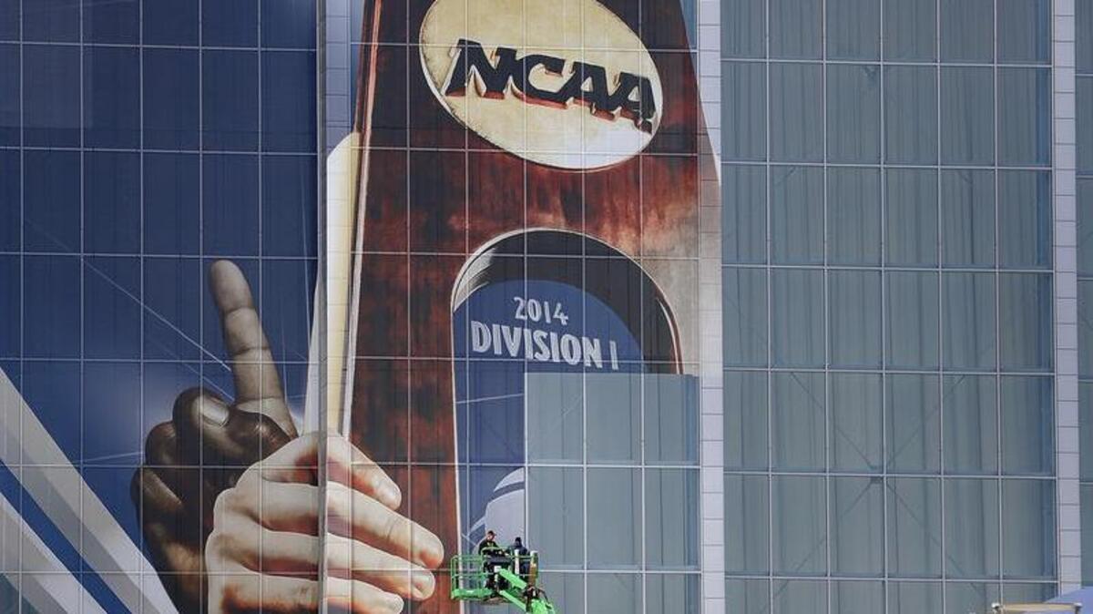 Crews install NCAA Final Four signage at AT&T Stadium in 2014. The Fort Worth and Arlington convention and visitors bureaus have formed a partnership to market each other's cities for events, such as the NCAA basketball tournament.
