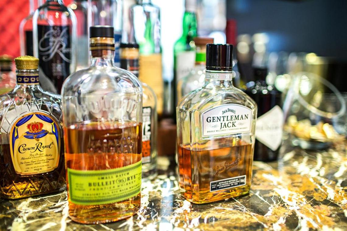 A small whiskey bar acts as the bridge between the two clothing concepts, Q Clothier and Rye 51.