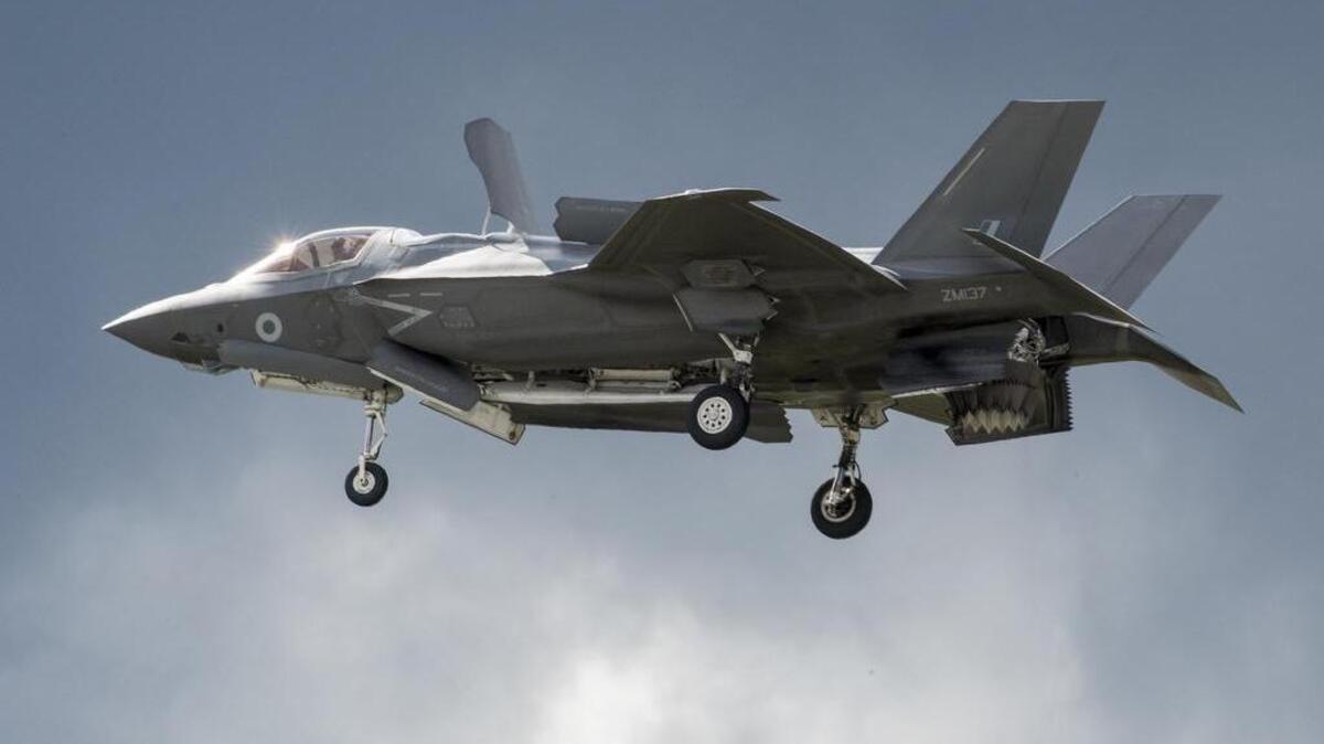 A F-35 fighter jet hovers in the sky while flying at the Farnborough Air Show in England on Tuesday.