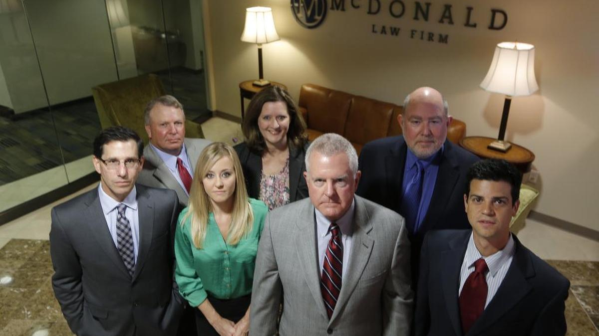 Attorney Dan McDonald, fourth from the left, lead a team of lawyers in suing Chesapeake Energy over unpaid royalties. Eventually, they won a $51 million settlement.