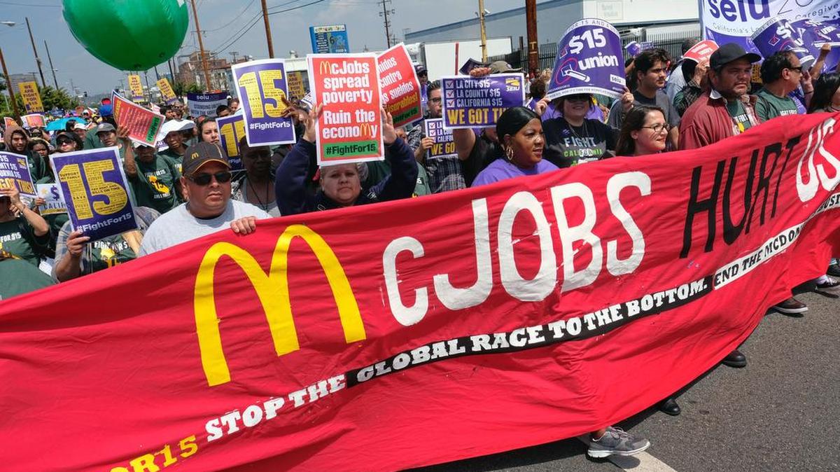 Protesters march to a McDonald's restaurant in downtown Los Angeles on Thursday.Protesters were calling for pay of $15 an hour and a union.