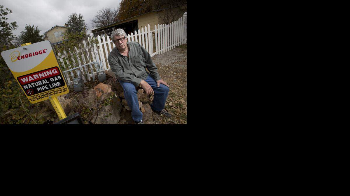 
Residents including Jon Salis near Palo Pinto have been getting untreated, natural gas that may be dangerous. Jon Salis poses at the gas line near his property on Thursday, December 4, 2014. 
