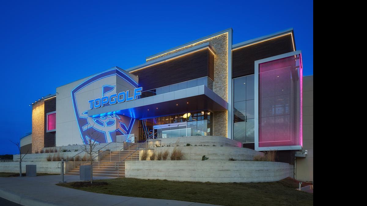 
At Topgolf, players win points by hitting golf balls at targets while enjoying food and drinks from a bar and restuarant.
