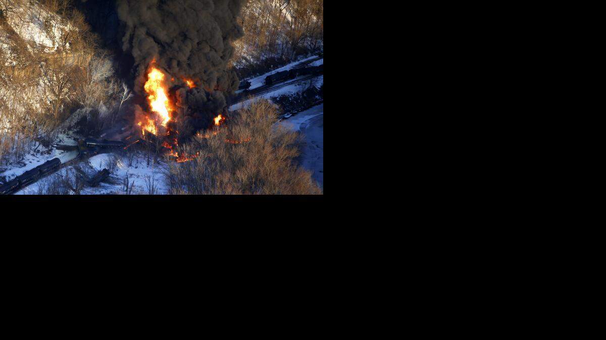
Smoke and flames erupt from the scene of a train derailment near Galena, Ill. A BNSF Railway freight train loaded with crude oil derailed in a rural area where the Galena River meets the Mississippi.


