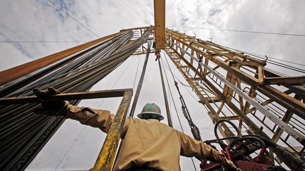 Attorneys, accountants and investment bankers were told there is a growing consensus that lower commodity prices will be around for some time — possibly as long as another 18 months.