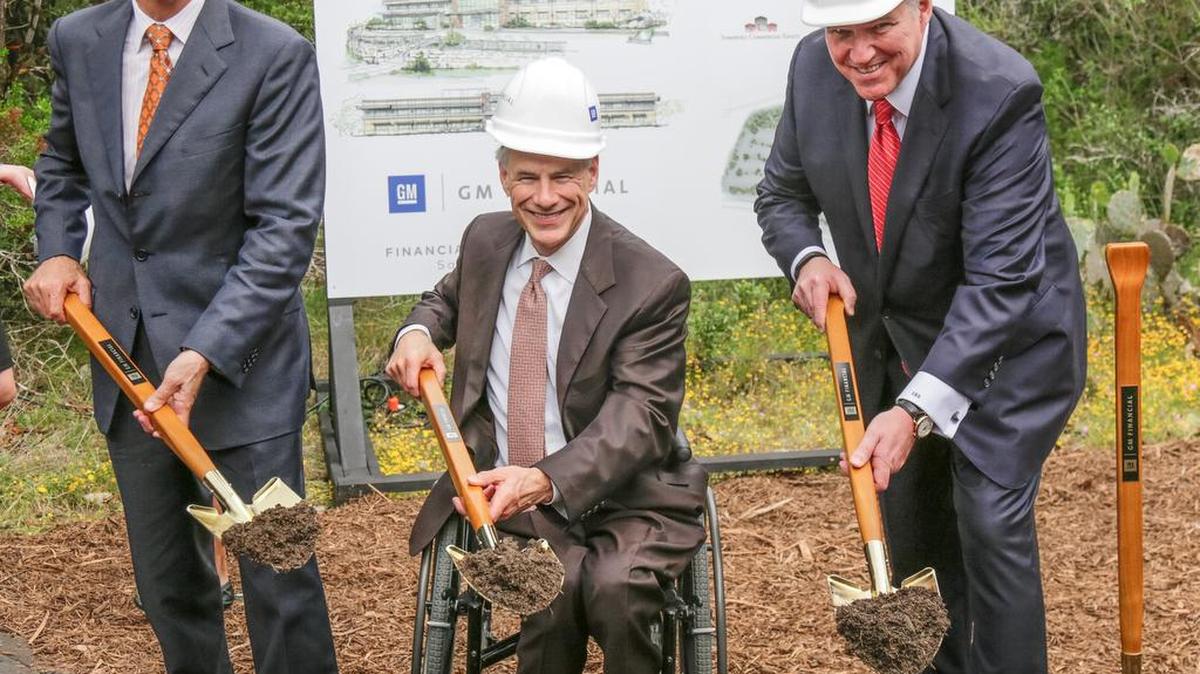 GM Financial CEO Dan Berce, left, Texas Gov. Greg Abbott and GM Executive Vice President and General Counsel Craig Glidden break ground on Monday for GM Financial’s new servicing center in San Antonio.