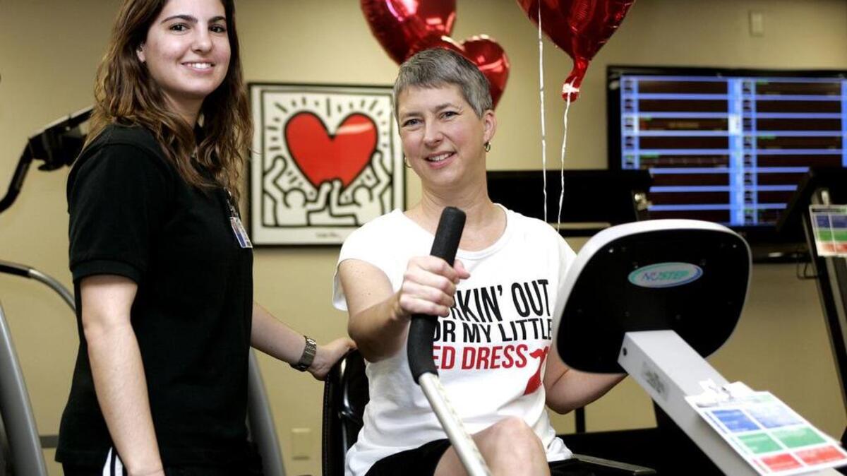 Exercise physiologist Halla Ali poses with Beth Brockenbush at Texas Health Arlington Memorial Hospital on Monday morning. Brockenbush participated in a year-old program that helps reverse heart disease.