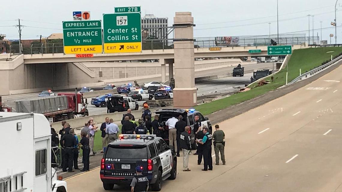 Police work the scene at a crash in Arlington Friday afternoon.