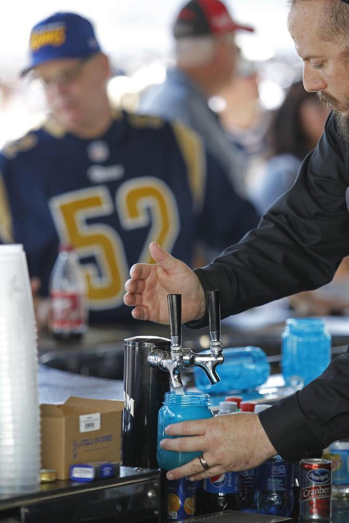 Liquor and beer bring in big bucks at AT&T Stadium before the Los Angeles Rams play the Dallas Cowboys.
