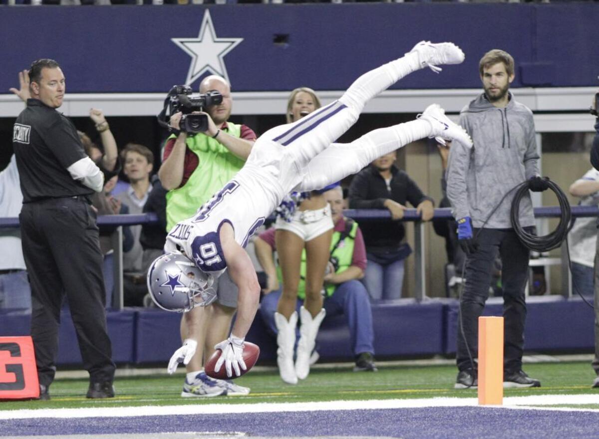 Dallas Cowboys wide receiver Ryan Switzer (10) somersaults into the end zone after running a Redskins punt back for a touchdown in the second quarter against the Washington Redskins on Nov. 30.