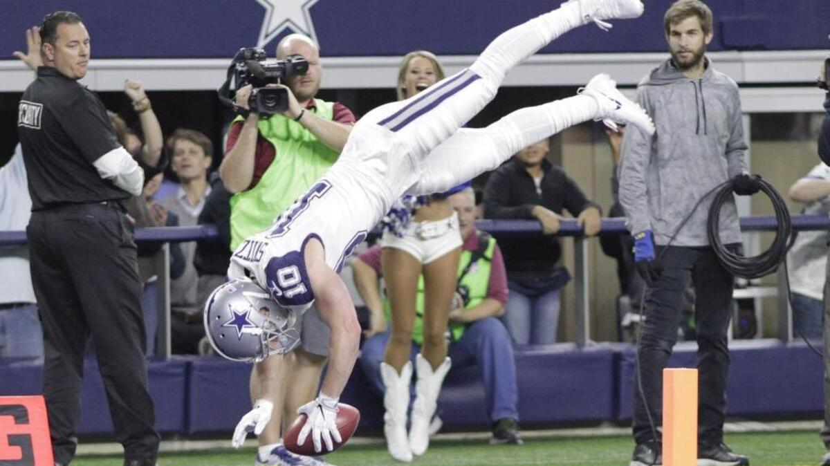 Dallas Cowboys wide receiver Ryan Switzer (10) somersaults into the end zone after running a Redskins punt back for a touchdown in the second quarter against the Washington Redskins on Nov. 30.