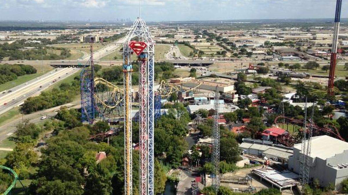 The Interstate 30-Texas 360 interchange is seen behind the Superman ride at Six Flags Over Texas. This photograph was taken before construction on the interchange began.