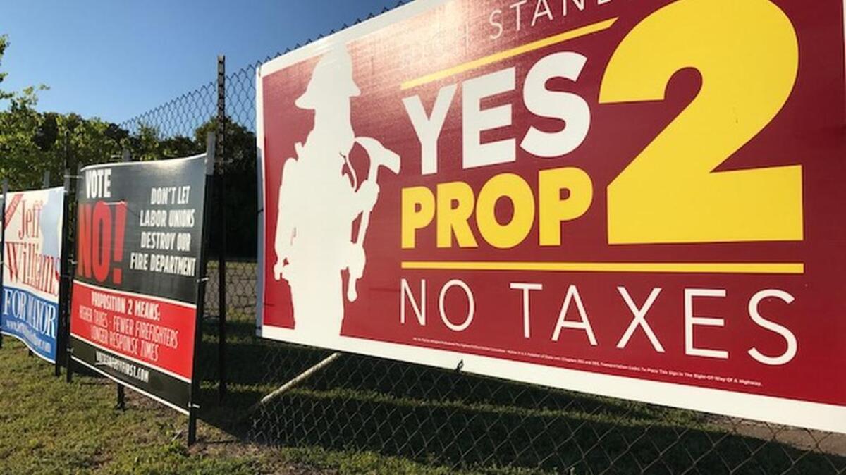 Campaign signs for and against civil service for the Arlington Fire Department were common around the city leading up to general city elections on Saturday