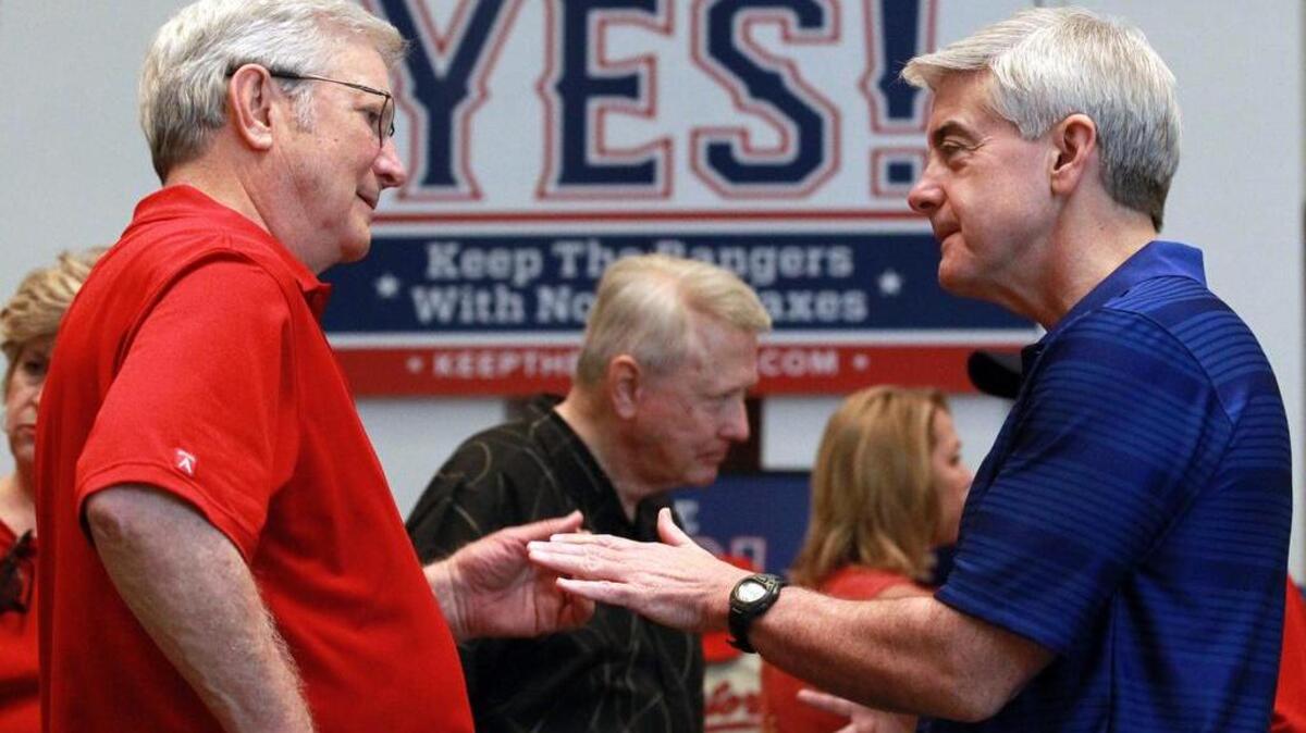 File - Former Arlington mayor and columnist Richard Greene, left,  talks with Victor Vandergriff at the kickoff of the Keep the Rangers campaign in 2016. Greene writes about the lack of civil disagreement in this week's column.