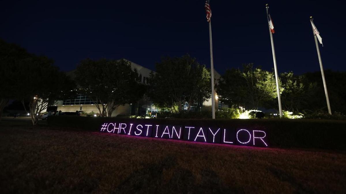 Demonstrators protested outside the Arlington police headquarters after the fatal shooting of burglary suspect Christian Taylor.