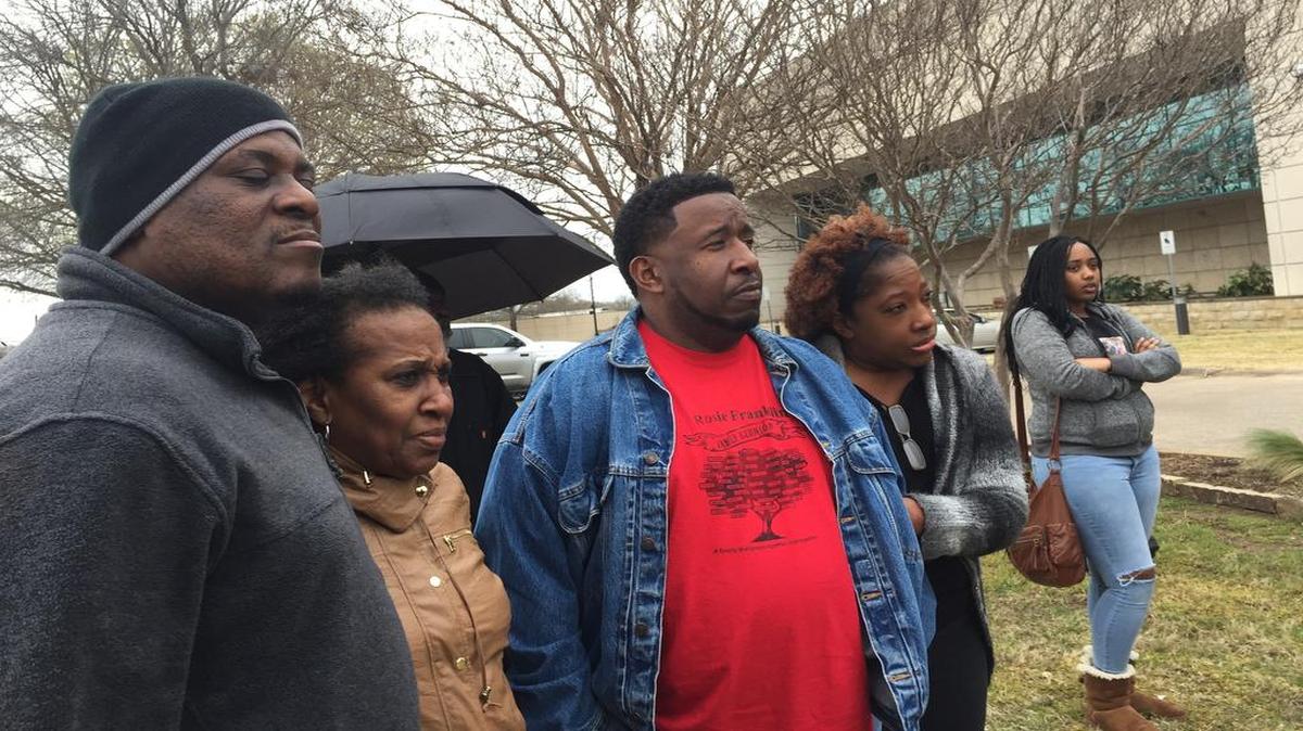 Tavis Crane’s father, Alphonse Hoston, grandmother, Beverly Millikin, uncle, Quincy Millikin, and his mother, De-on Crane, joined protesters in Arlington in 2017 as they demanded the release of the dash cam video that would show how their family member died.